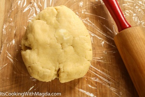 ball of a tart dough with a rolling pin